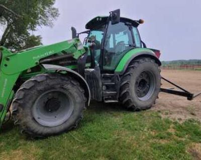 Deutz Fahr 6155 with loader and grapple. 3031 hours 2017 model