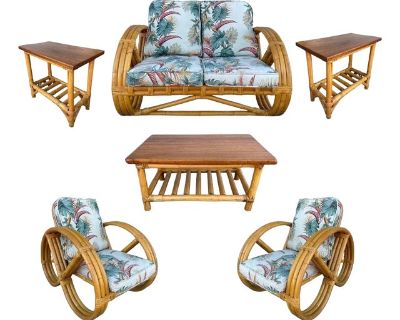 This rare beautifully restored three-strand round full pretzel arm rattan living room set features a pair of round pretzel lounge chairs, matching settee with fancy wicker wrappings, along with 2 ladder-style side tables with a matching ladder coffee table. This Frankl style set was meticulously refinished to highlight the natural rattan s warmth and durability. It is perfect for creating a sty...