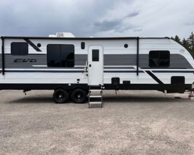 2026 Forest River EVO Lite 2650RTX Idaho Toy Haulers RV, Hitch Weight - 950 lb. GVWR - 11,150 lb. UVW - 6,418 lb. CCC - 4,732 lb. Exterior Length - 32' 2" Exterior Height - 11' 5" Exterior Width - 96" Fresh Water - 61 gal. Gray Water - 32 gal. Black Water - 32 gal. Awning Size -20' Standard Features E-Z Lube Axles Self-Adjusting brakes Full extension ball bearing drawer guides Radius entry door...