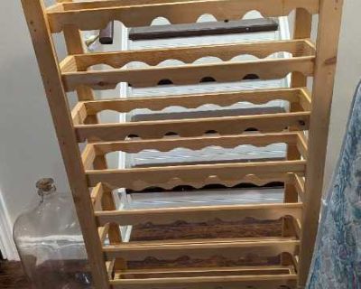 Wooden wine rack and glass carboy
