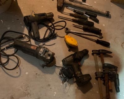Bucket of tools . Drill, heat gun,