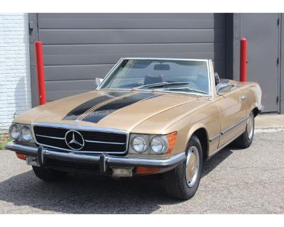Odometer: 91569. A 1973 Mercedes Benz 450SL Roadster R107. Currently gold with black stripes, but the original color is yellow with a black leather interior. Two tops. 91,000 original miles. Small bumpers car. The paint is old. The black stripes are decals. There is some body filler, and has had some rust work done as you can see in the pictures. The original black leather interior is there but...