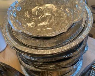 Stack of clean aluminum pie tins