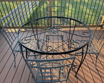 Wrought iron table and metal chairs