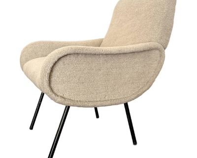 The baby Zanuso chair by Marco Zanuso for Arflex with original label intact. This chair is called the baby Zanuso but it is sized for an adult as a side chair or a desk chair or a chair for any usage. Re upholstered recently in a furry lambswool. Legs are enameled black and the chair is in excellent condition. Can be used as is or reupholstered. Overall size: 26" x 27" x 32". Seat height: 18". ...