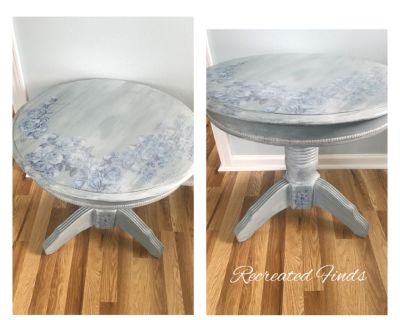 Unique refinished side table . Finished with chalk paint and a white glaze applied .