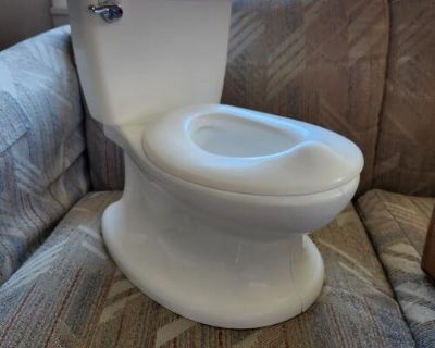 New Summer kids potty chair. White in color and makes flushing noise. 20 firm