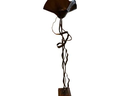 This is a unique floor lamp in the brutalist style. This piece is all handmade of steel with a square base and organic body with a handkerchief style shade which holds one full size bulb. This lamp is signed on the base.. Dimensions 17 W 17 D 76 L Styles Brutalist Lamp Shade Included Period 1990s Country of Origin United States Item Type Vintage, Antique or Pre-owned Shop Sustainably with Chair...