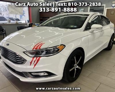 Step into luxury and style with this sleek White 2017 Ford Fusion. This stunning sedan is equipped with a powerful 2.0L EcoBoost engine, ensuring a smooth and efficient ride every time you hit the road. The sophisticated exterior features chrome accents, fog lamps, and a sporty wing spoiler, making heads turn wherever you go. Inside, you'll find a spacious and comfortable interior with leather ...
