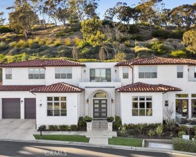 75 Marbella. Gorgeous custom home in the exclusive guard-gated Sea Pointe Estates with 4 ensuite bedrooms, each with its own bathroom. With sweeping ocean and city-lights views from a private corner lot, this home is light and airy with soaring 12 ft ceilings accented beautifully with wooden beams throughout. The open kitchen features a Thermador range, quartz countertops, reverse osmosis water...