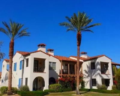 77709 Tradition Dr. Fully furnished villa in prime location with mountain views. This residence offers 2 bedrooms, 2 bathrooms with soaking tubs, 2 private terraces, 2 fireplaces, a fully equipped kitchen, queen sofa bed, in-unit laundry, and private garage parking. Sleeps up to 6. Community amenities include 12 salt-water pools with cabanas, beach-entry kids' pool with splash area, Jacuzzis, h...