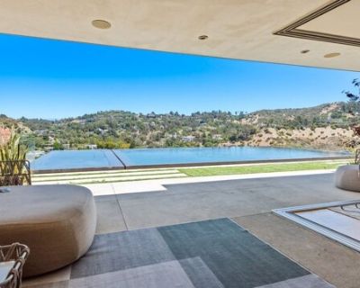 7551 Hermes Dr. Fully furnished!! Walk into this partially gated Mount Olympus home with city and canyon views. Contemporary style and beautiful views make this an amazing place to call home. The home boasts one of the largest infinity pools in LA and includes 2 MASTER Suites. This 4 bedroom and 4 bathroom home offers a great spot for those looking to be close to the lights and action of the Su...