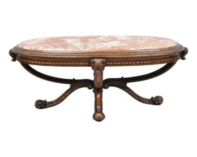 Antique Grosfeld House (attributed) French Regency Style Prince of Wales Plume Carved Oval Mahogany Coffee Table with Pink Rouge Marble Top. Circa Early 20th Century. Measurements: 20.5" H x 51" W x 27.5" D.. Dimensions 51 W 27.5 D 20.5 H Styles Regency Table Shape Other (unique shapes) Period Early 20th Century Item Type Vintage, Antique or Pre-owned Shop Sustainably with Chairish Materials Ma...