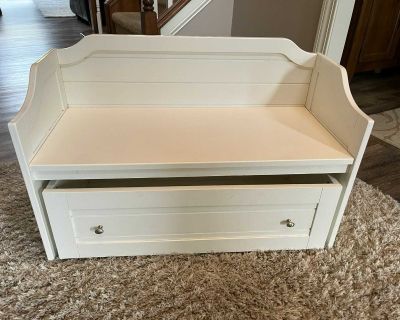 Pottery Barn kids bench with pull out drawer on wheels.