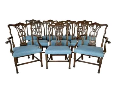 Fabulous Set of Ten Late 19th Century Georgian Chippendale Style Carved Mahogany Dining Chairs. Each chair features a pierced and intricately carved back splat with scrolling acanthus details, shaped crest rails, and hand-carved ornamentation inspired by the elegance of 18th century design. Seats are upholstered in a later blue fabric, supported by square molded legs joined with stretchers, and...