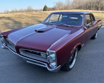 Odometer: 10. 1966 PONTIAC GTO TRIBUTE PRO TOURING 6.2 LS/525 HP 4 speed automatic overdrive transmission Red Exterior Black Interior Meticulous frame-off restoration just completed. Less than 10 miles since the restoration Fresh basecoat and clearcoat paint Frame blasted and painted with black Impron paint All new resto parts factory interior including rugs and headliner All new Bucket seats w...