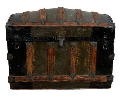 This is a beautiful antique camel back steamer trunk chest. Gorgeous wood and metal trunk that shows obvious signs of aging, but is solid and would make such a cool home accent. Has a dancing boy and girl image under the lid. Dimensions: - 34 width - 21 depth - 24 height - 32 inside width - 19 inside depth - 16 inside height. Dimensions 34 W 21 D 24.5 H Styles Traditional Period Early 20th Cent...