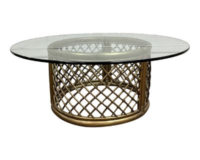 This is an absolutely beautiful vintage Boho style rattan and glass round coffee table or cocktail table. Rattan is gold colored. Solid and sturdy, with only minor cosmetic imperfections consistent with age. Dimensions: - 42 in wide - 42 in deep - 16.75 in tall. Dimensions 42 W 42 D 16.75 H Styles Boho Chic Mid-Century Modern Table Shape Round Period Mid 20th Century Country of Origin United St...