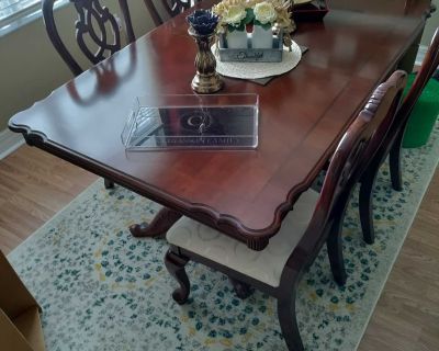 Dark cherry wood dining room table