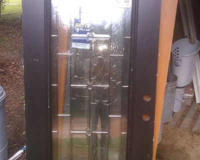 Really nice metal front door with glass inlay