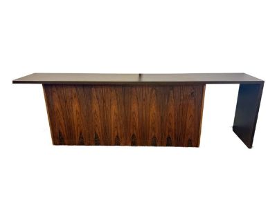 Vladimir Kagan sideboard is crafted from elegant rosewood and features a meticulously designed custom top that glides effortlessly from side to side to suit any space. Behind the elegant fa ade are roomy cabinets with adjustable shelving, providing ample storage for dinnerware, barware, or collectibles. Perfectly suited to dining rooms, living rooms, or entryways.. Dimensions 109 W 18 D 33 H St...