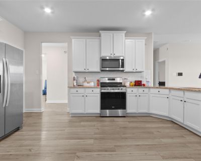 3009 Floating Barque Drive. Discover , an impeccable, nearly-new 4-bedroom, 2-bathroom home built in 2023, offering 2,188 sqft of spacious living space in the highly sought-after Lago Mar community. Inside, a bright, open floor plan welcomes you with high ceilings and modern finishes. The gourmet chef s kitchen boasts polished granite countertops, sleek white cabinetry, and stainless steel appl...