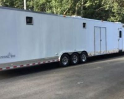 2011 Vintage Enclosed Car Trailer with Living Quarters For sale: 2011 Vintage Enclosed Car Trailer with beautiful living quarters, perfect for extended trips or races. The trailer features a full bathroom, ensuring comfort on the road, and offers approximately 32 feet of garage space, fully equipped with Pit Pal storage solutions for easy organization. There's an outside sink for added convenie...