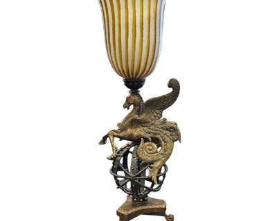 Illuminate your space with this extraordinary Pegasus table lamp, featuring a winged horse poised atop an armillary-inspired celestial base. Finished in antique bronze and topped with a striped blown glass shade, it s a captivating blend of art and light.. Dimensions 39.5 W 20.5 D 20.5 L Styles Art Deco Neoclassical Revival Lamp Shade Included Brand Fine Art Lamps Period 2000 - 2009 Country of ...