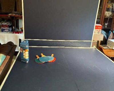 Free Fold up ping pong table, full size, includes paddles and balls. In excellent condition. It is also on wheels for easy moving when storing it.