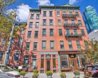 66 MORRIS ST, 303. Enjoy Paulus Hook living in this beautiful spacious 2BR/2BTH in newer construction building with secure entrance, elevator and common courtyard. This sun-filled space has an open living room/dining layout which features exposed brick, gleaming hardwood floors, modern kitchen w/cherry cabinetry and S/S appliances. The master bedroom has its own en-suite bath equipped with jacu...