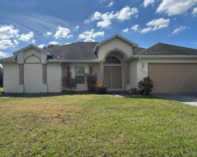 SW Gadshaw Road. Great 3BR/2BA/2CG CBS home offering 1,928 sq ft under air with a spacious screened patio. This well-maintained property features new SS kitchen appliances, new flooring, newer 2021 roof, freshly painted interior. The bright, open split floor plan provides generous living and dining areas, perfect for comfortable everyday living. The kitchen offers ample cabinet space and overlo...