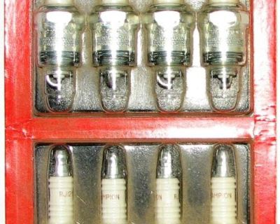 Champion spark plugs still in the original container a set of eight RJ12YC