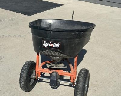 AgriFab pull behind fertilizer spreader. Tires hold air. Everything works great.