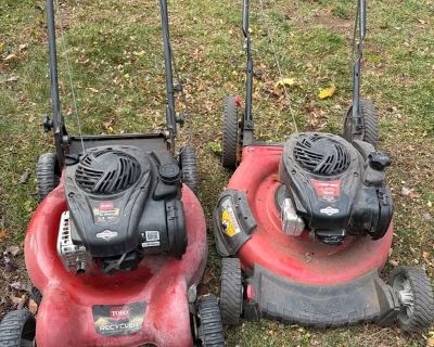 Two lawnmowers ready to go