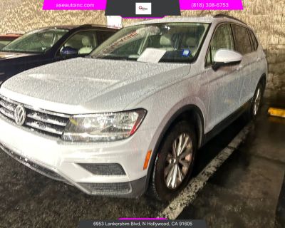 Mileage: 95,383. Year: 2018. Make: Volkswagen. Model: Tiguan. Trim: 2.0T SE 4MOTION Sport Utility 4D. Auto, 8-Spd Tiptronic Spt transmission. Exterior: White. Interior: White. Interior: Alarm System, Electromechanical Steering, Backup Camera, Power Door Locks, VW Car-Net, CD/MP3 (Single Disc), Power Windows, Air Conditioning, Alloy Wheels, ABS (4-Wheel), Daytime Running Lights, Hill Descent Con...