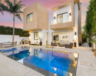 454 N Sweetzer. Tucked behind gates for total privacy, this modern home has everything you need to relax, entertain, and enjoy the California lifestyle. Step inside to find vaulted ceilings, skylights, and large windows that flood the space with natural light, creating an open and airy feel throughout. The main house opens up to a peaceful backyard with a sparkling pool, fire pit, and patio are...