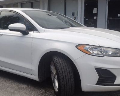 2019 Ford Fusion SE hybrid. 31,000 MI. white with black. interior. new tires brakes cold air condition navigation. backup camera. I Am fmcd stereo premium. must sell. very clean car fully loaded. please call. 305-746-3448