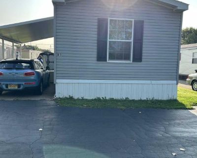 3473 South Park Lot D3. Newer 16' wide manufactured home, spacious open floor plan, 22' living room with wood burning fireplace, stone surround, wood mantle. Living room open to kitchen dining, raised breakfast bar, oak cabi .... 2 Bedroom. 2 Bathroom. 1056 ft